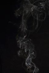 Abstract white smoke texture on black background