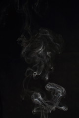 Abstract white smoke texture on black background