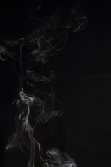 Abstract white smoke texture on black background