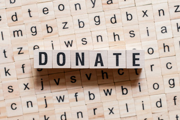 Donate word concept on cubes