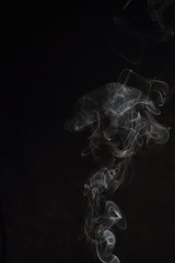Abstract white smoke texture on black background