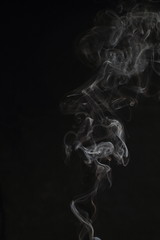Abstract white smoke texture on black background