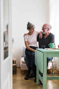 Happy elderly couple relaxing at home