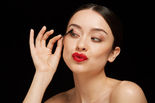 Woman classic beauty portrait using mascara