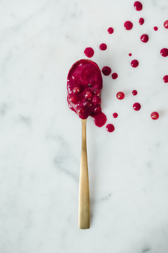 golden spoon with currant coulis