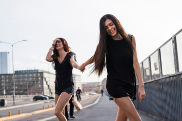 Two friends having fun in the city