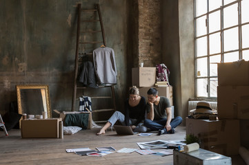 Couple choosing prints for new home