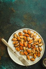 mussels in oil and spices (appetizer mollusks, pickled seafood, healthy food) menu concept. food background. copy space. Top view