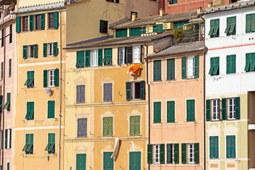 Fototapeta na wymiar Colorful facades of the old houses of Camogli, Liguria. Italy