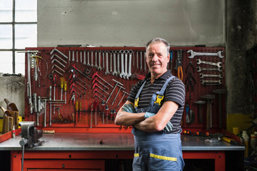 Mechanic portrait in the garage