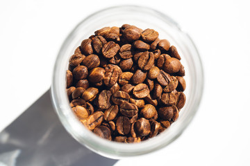 Large glass jar full of coffee beans.