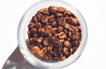 Large glass jar full of coffee beans.