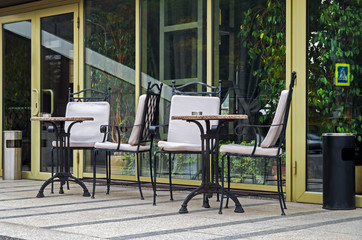 Naklejka na ściany i meble Tables and chairs on terrace