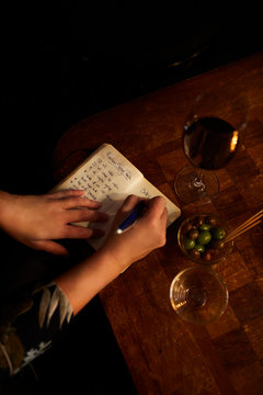 A mixologist drinking her recipe.