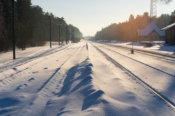 Perspective view to railway covered with snow