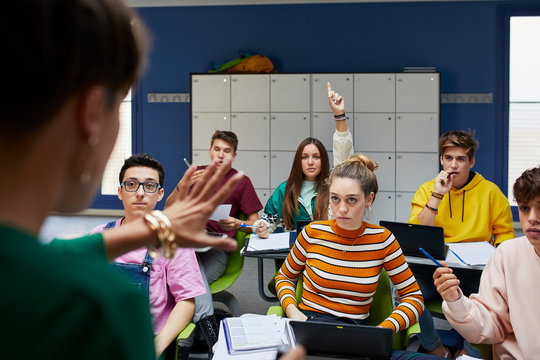 Teenage students participating in the class