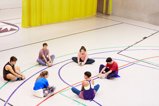 Teenage students making exercise