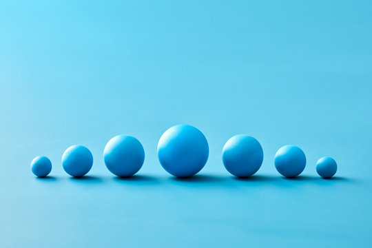 Row of different blue spheres