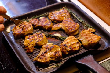 grilled beef steak with rosemary on frying pan