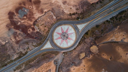 Road around beautiful symbol in dry countryside
