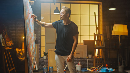 Portrait of Talented Artist Working on Abstract Painting, Uses Paint Brush To Create Daringly...