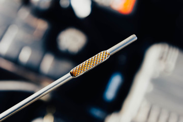 Automotive oil dipstick to check engine oil level. Diagnosis of engine failure.