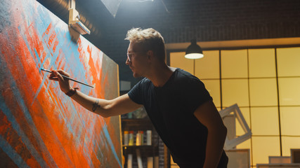 Talented Artist Working on Abstract Painting, Dips Brush in Paint and Starts Drawing Daringly...