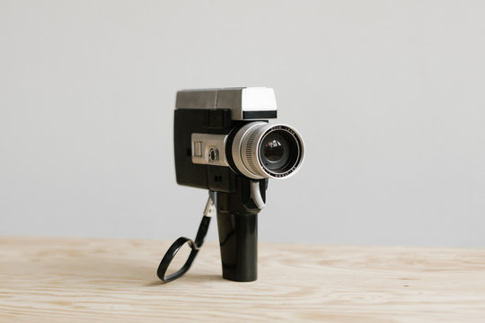 super 8 film camera sitting on plywood table