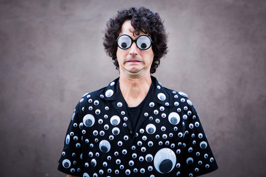 Man Wearing Suit Covered in Googly Eyes
