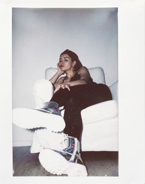 Brunette Girl Chilling In Armchair Polaroid