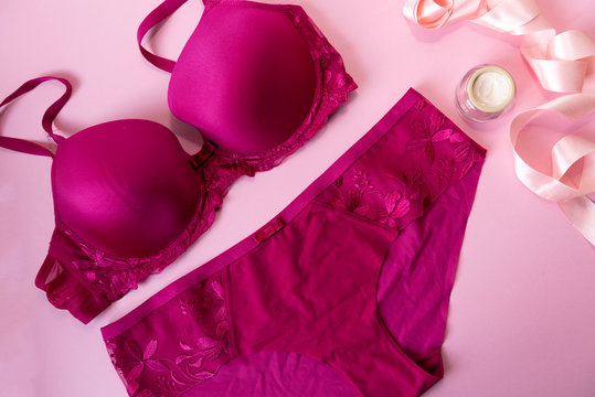 Set of glamorous stylish sexy lingerie with cosmetic products, on a pink background. Shopping fashion and self care concept. flat lay.
