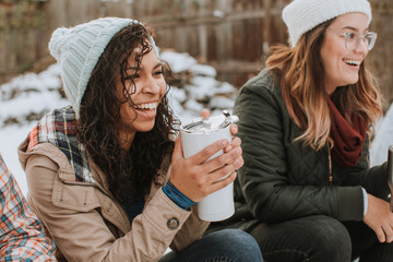 Group of Friends Laughing Outdoors at Campsite