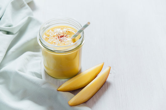 Drink: Mango Lassi in a glass, vegan with coconut yogurt