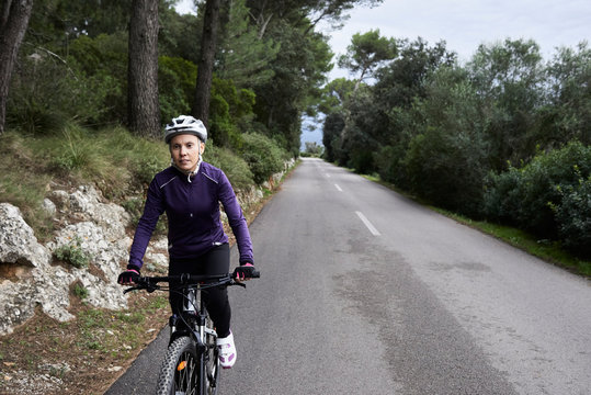 Cyclist riding bike mountain.
