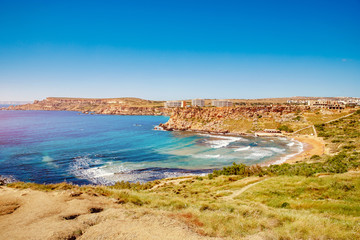 Fototapeta premium Panorama Golden Bay Malta summer tourist resort beach azure water sea, . Concept travel