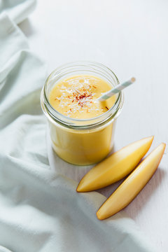 Drink: Mango Lassi in a glass, vegan with coconut yogurt