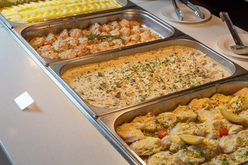 Buffet in the dining room-fish, beef, mashed potatoes, cutlets, . Smorgasbord