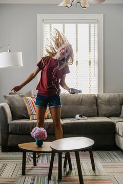 Teenager Dancing in Living Room