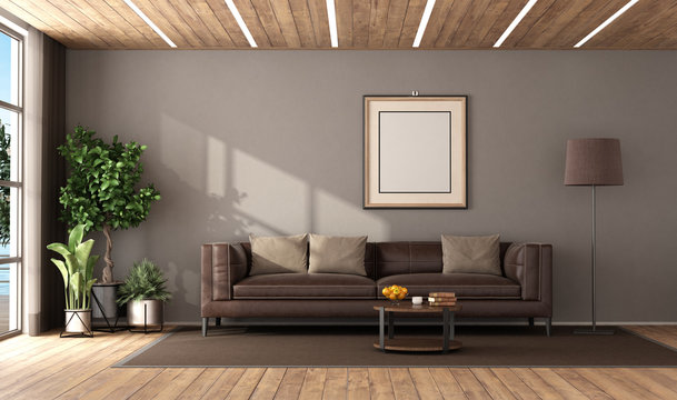 Modern living room with brown leather sofa