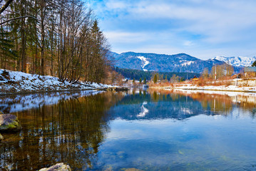 Scenic picture-postcard landscape with lake Traun, forest and mountains  in Austrian Alps. Beautiful view in winter. Austria, Bad Goisern