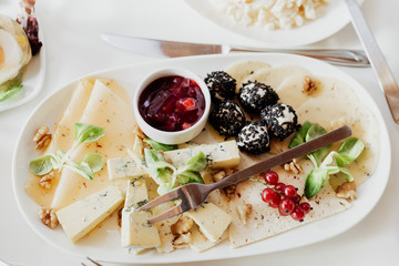 plate with various types of cheese, top view