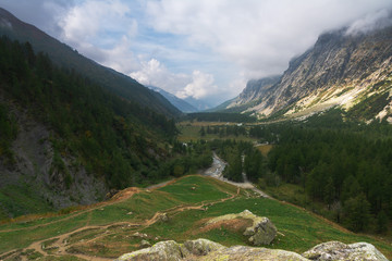 Beautiful scenery from the Italian Alps with picturesque rivers and waterfalls, cliffs and magical mountain valleys
