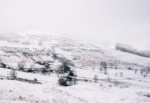 Rural snow covered farm. Castleton, Derbyshire, UK.