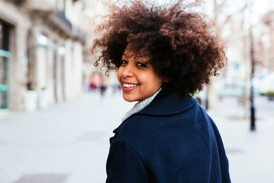 Mature afro hairstyle woman in the city.