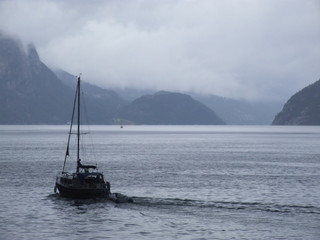 Fototapeta premium the ship sails on the fjord