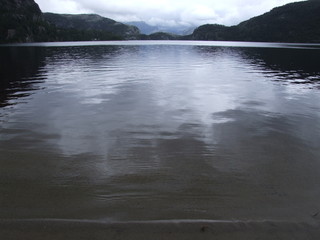 the Pacific coast of the fjord , the water, rocks and greenery