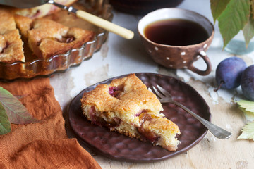 Plum pie or cake with cinnamon and sugar. Selective focus.