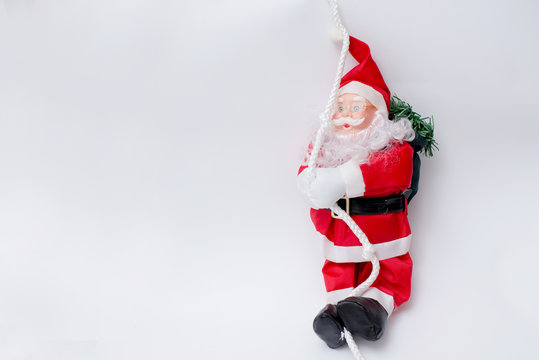 Santa Claus with christmas tree on white background . happy new year