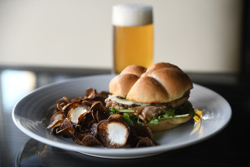 Close up of burger with roasted mushrooms on plate