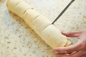 cinnamon buns - Cinnabon cooking process raw dough.food background